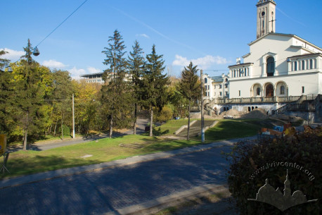 Vul. Lychakivska. Space between the fir trees is the location of the monument to Soviet tankmen