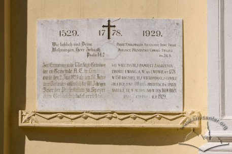Vul. Zelena, 11b. Plaque installed on the principal facade in 1929 commemorating 150th anniversary of the church building founding and 400th anniversary of Protestantism in Poland