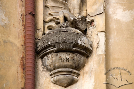 Vul. Drukarska, 11. Corbel which supports the statue of st. Michael. The construction year and the architect's name are carved here