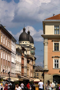 Vul. Krakivska, a view from Rynok square. The domes of the church can be seen above the residential buildings