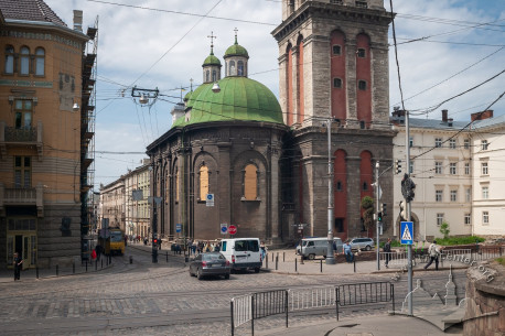 The church windows with valuable stained glass are covered with protective constructions