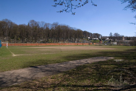 Vul. Vachnianyna, 1.  One of the training fields of the stadium. Fragment of the Lychakivskyi cemetery is seen on the background.