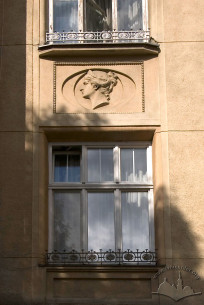 Vul. Konopnytskoi, 8. A window on the 2nd floor with a medallion above it
