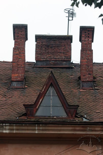 Detail of a ceramic tile roof with a dormer window