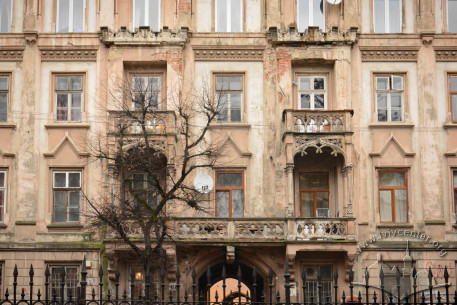 Vul. Stefanyka, 11. Part of the main facade featuring stylised medieval towers, with balconies richly decorated with tracery