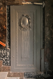 Vul. Halytska, 21. A wooden panel by the entrance