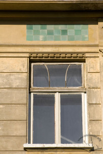 Vul. Bohomoltsia, 5. A 4th floor window with decorative ceramic tiles above it