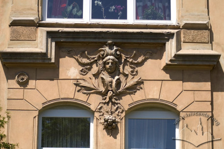 Vul. Kotliarevskoho, 24. A decorative detail above some 2nd floor windows